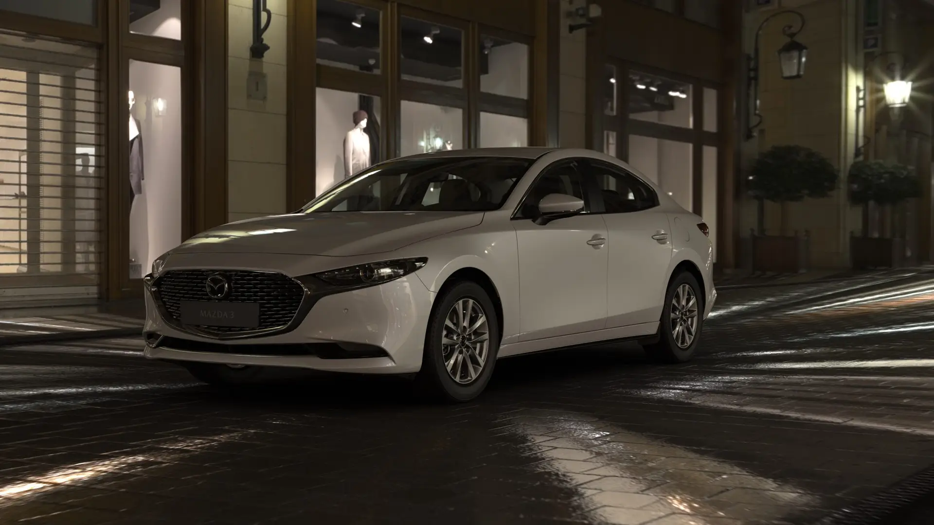 Mazda 3 vista frontal nocturna en boutique
